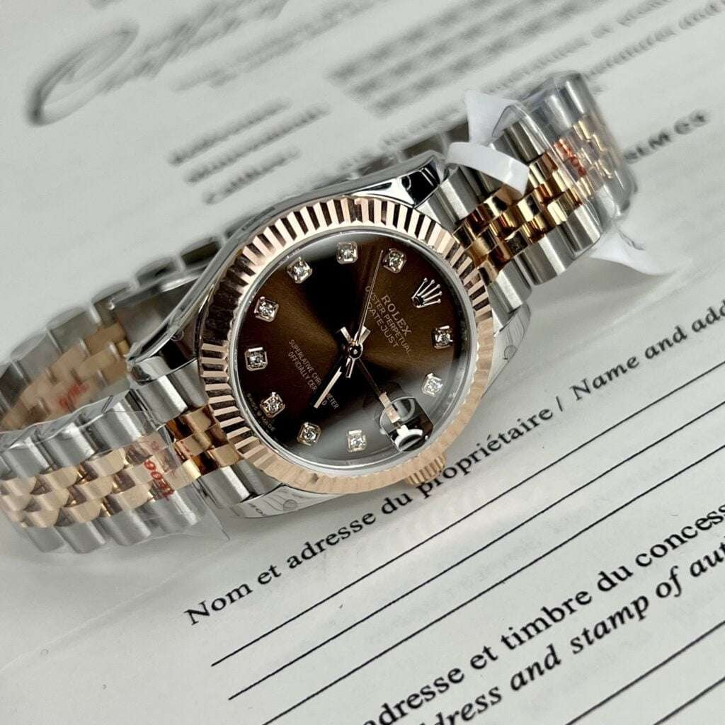 Dong-Ho-Rolex-DateJust-Nu-Boc-Vang-That-Mat-So-Mau-Nau-Nha-May-GM-31mm-7.jpg